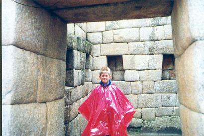 David Cobin with his rain gear stands inside a ceremonial room (chamber of the princesses) of the Incan Qorichanca (sun) temple ruins in Cusco, Per�