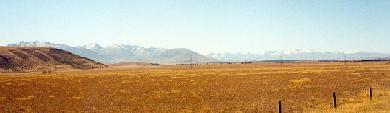 Endless plains of south central New Zealand (South Island), near Twizel, with the Southern Alps and Mt. Cook in the distance