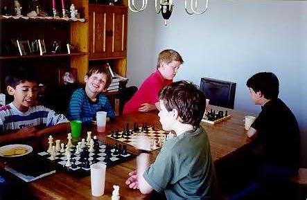 Alejandro, David, Daniel, Joshua and Felipe playing chess at our house (Feb. 1998)