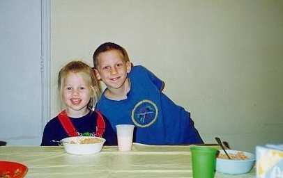 Daniel next to Rachel eating