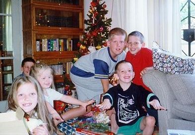 Kids opening Christmas presents