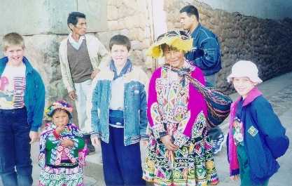 David, Joshua, and Daniel with an Indian girl in Cuzco, Peru