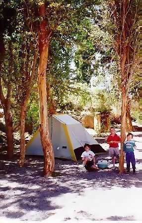 Joshua, David and Daniel in front of their tent in El Tr�nsito