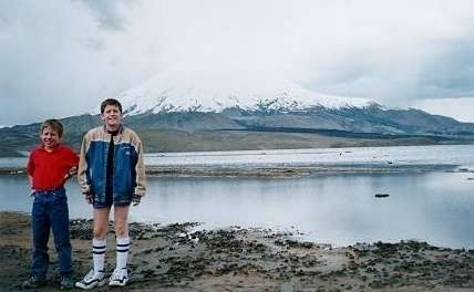 Daniel and Joshua in front of a volcano and a flamingo lake the border of Bolivia and Chile (Feb. 2000)