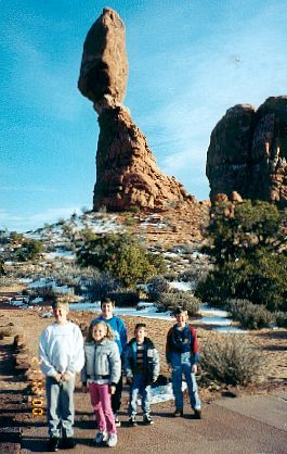 David, Grace, Joshua, Matthew, and Daniel in front of the balanced rock in Arches National Park (November 20, 2000)