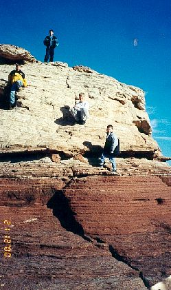 (from bottom) Matthew, David, Daniel, and Joshua climbing a rock in the Canyonlands National Park (November 20, 2000)